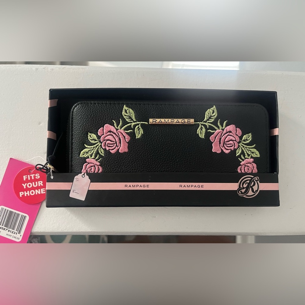 Brand new rampage wallet. Black and Pink, fits phone